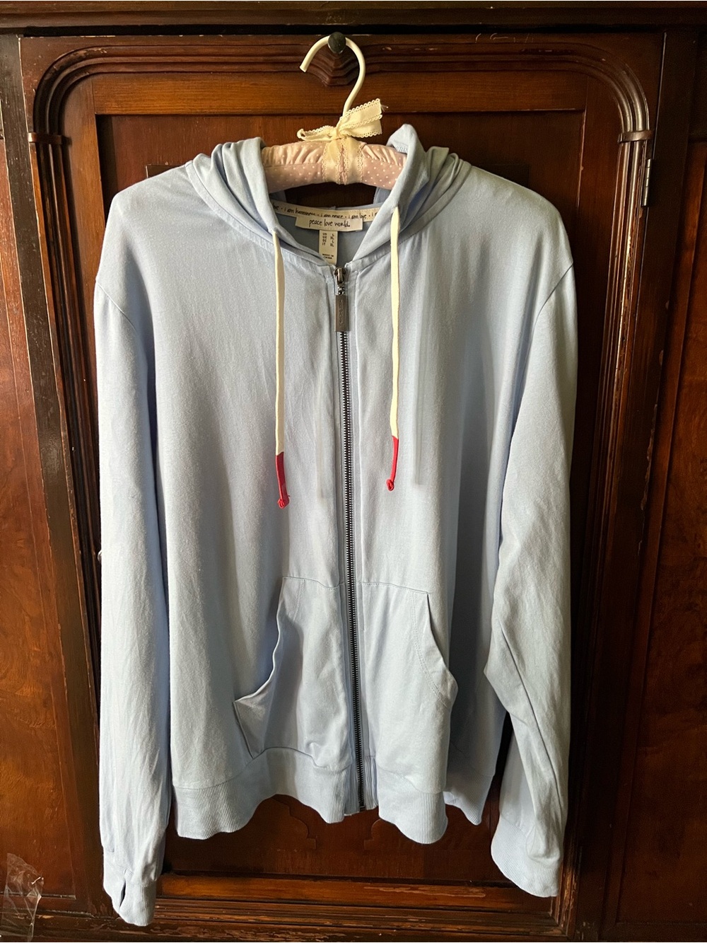 Peace Love World Pale Blue Zip Hoodie with Cream Drawstrings